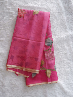 Pink saree with floral patterns on a
