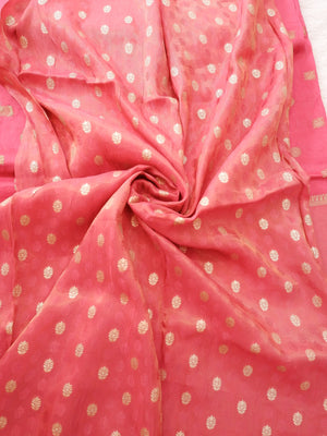 Pink fabric with gold polka dots,