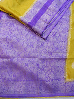 Purple and yellow fabric with intricate patterns