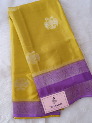 Yellow saree with purple border