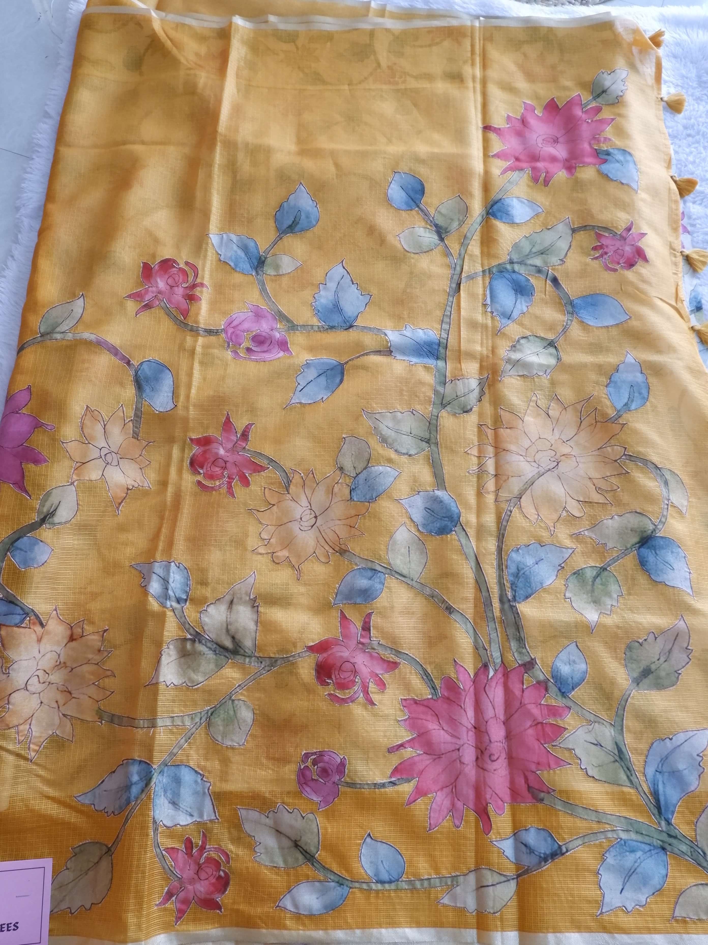 Fabric with floral pattern on a yellow 