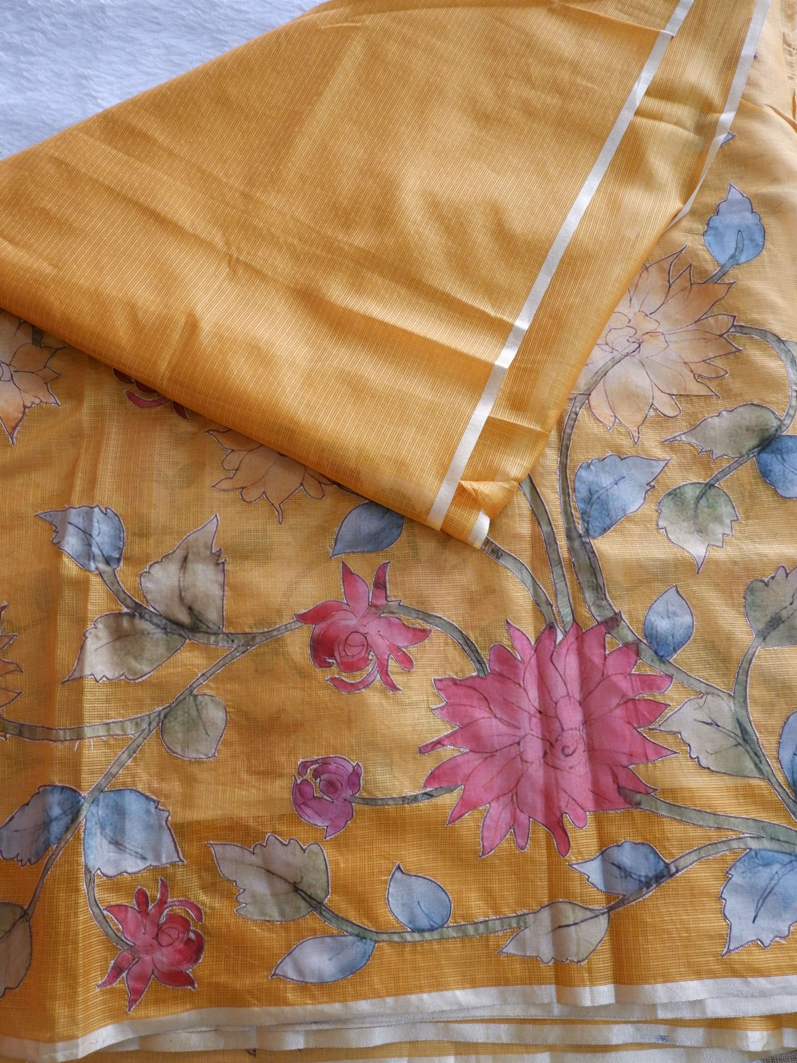 Yellow fabric with floral patterns on a yellow
