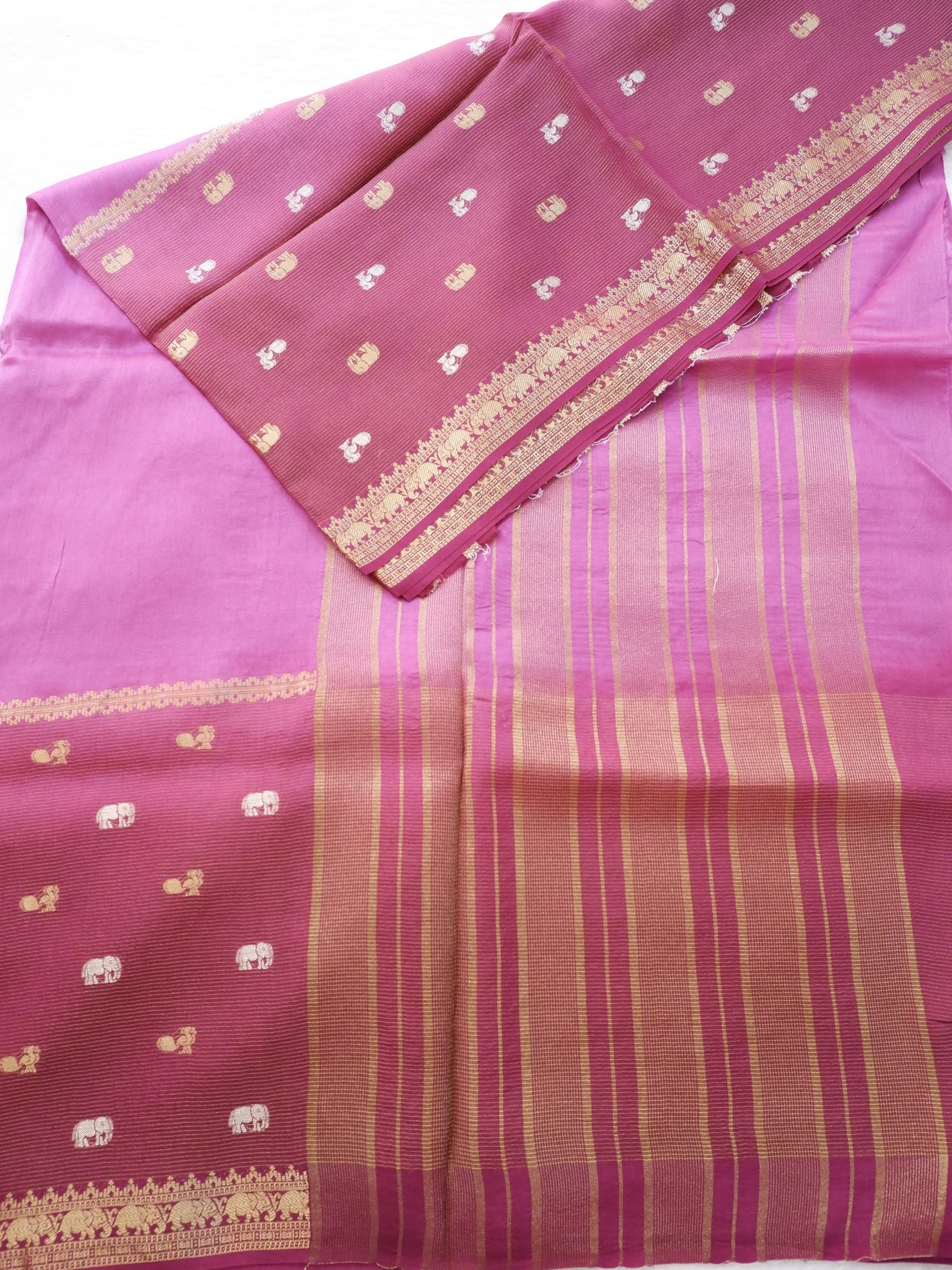 Pink saree with gold border and patterns 
