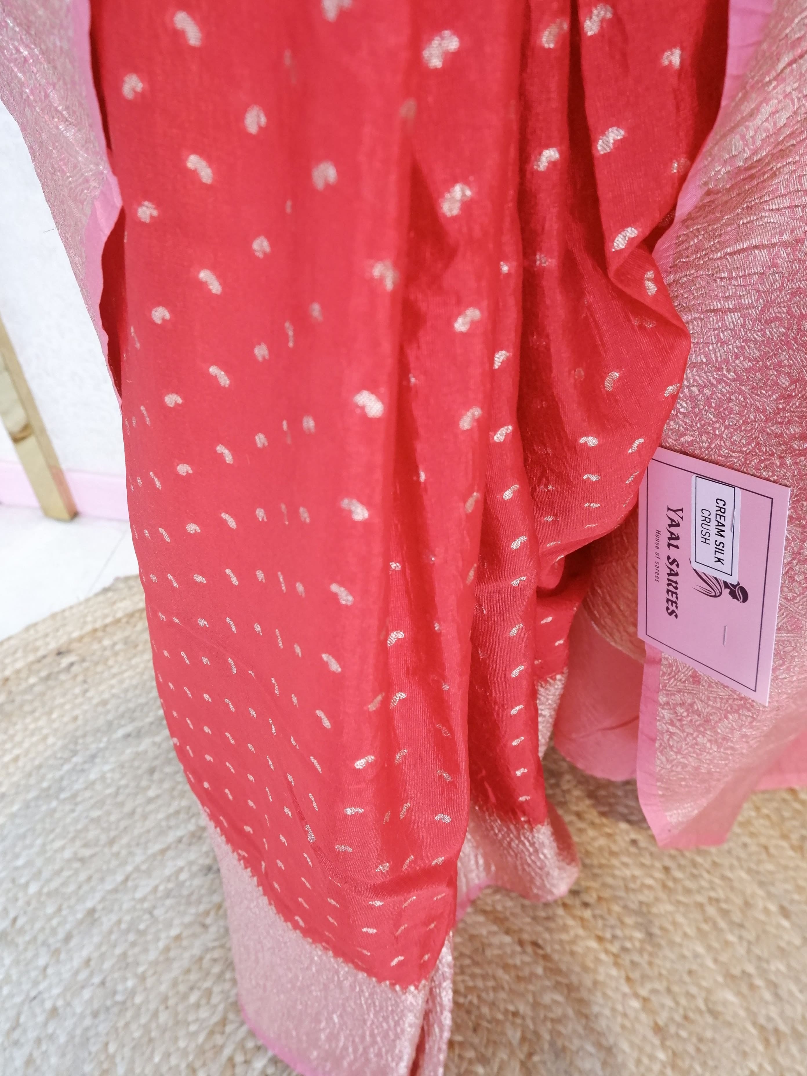 Red saree with white patterns