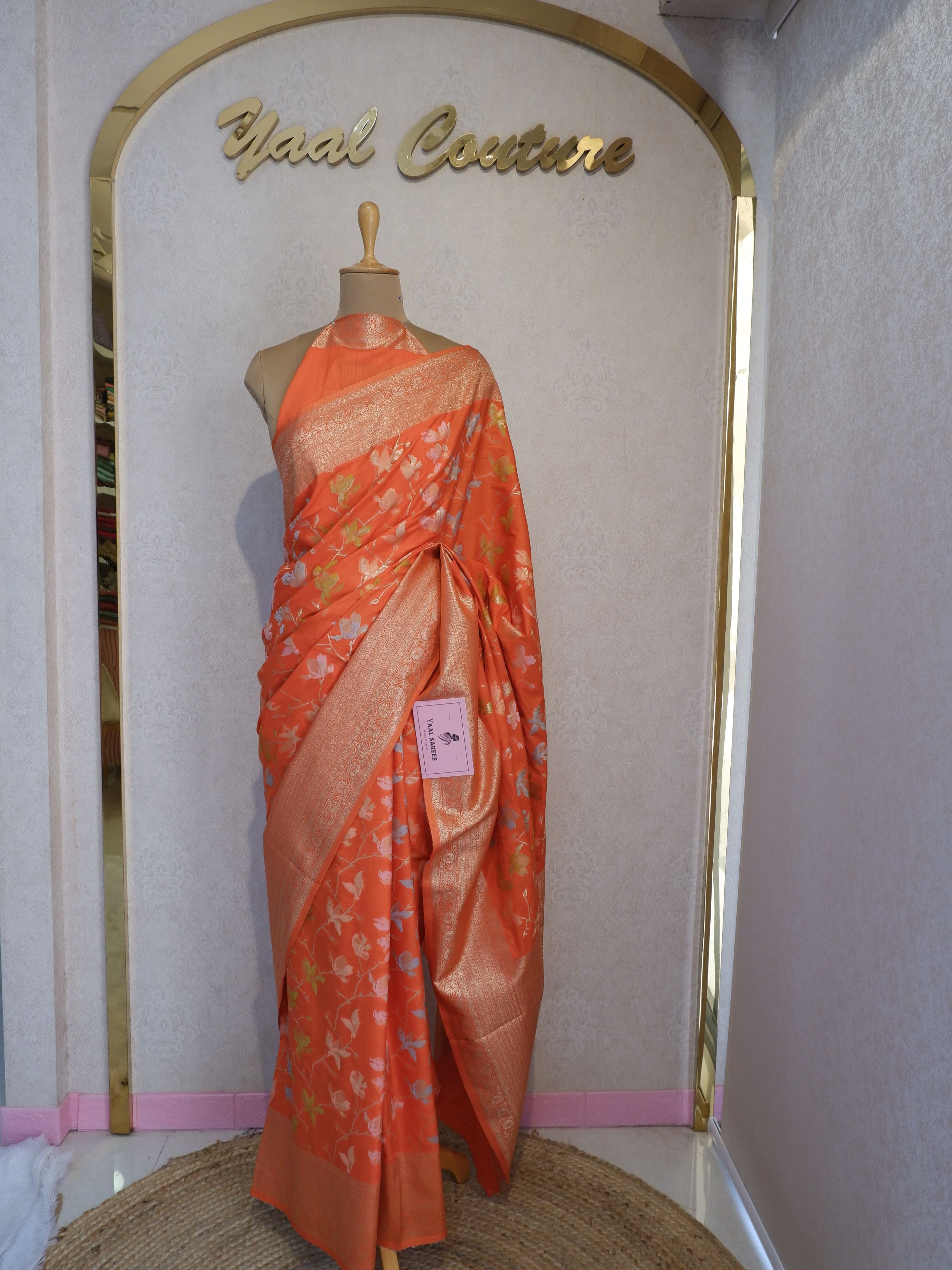 Orange saree with gold patterns