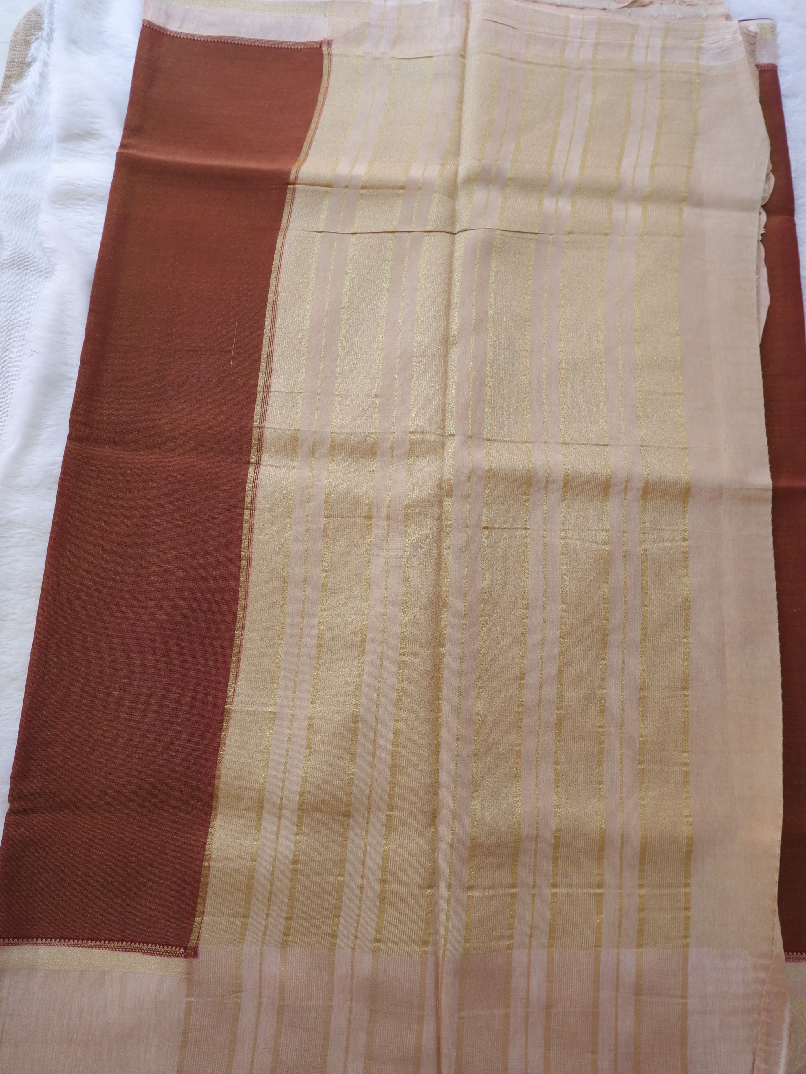 Fabric with a brown and beige pattern 
