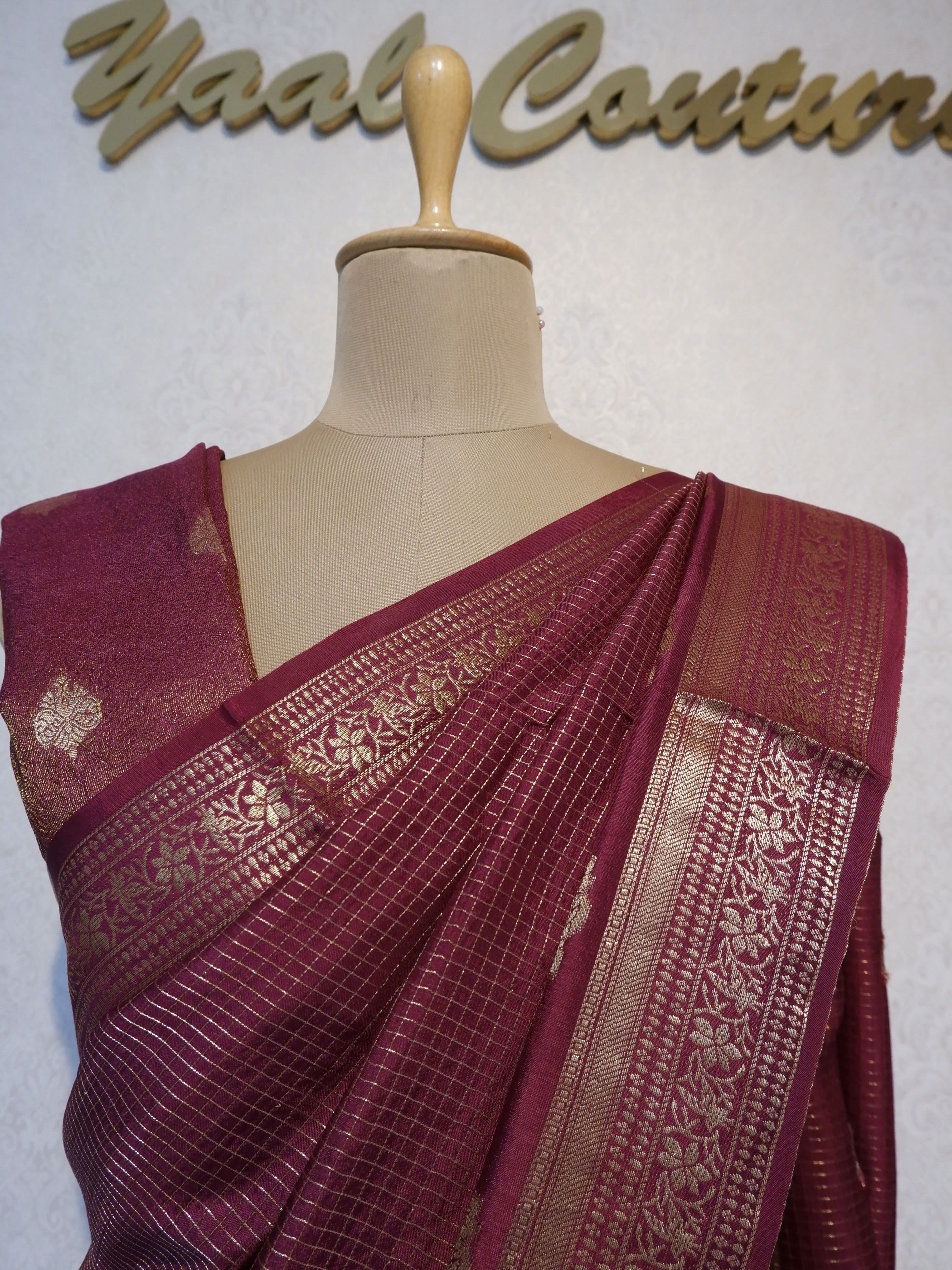 Maroon saree with gold patterns