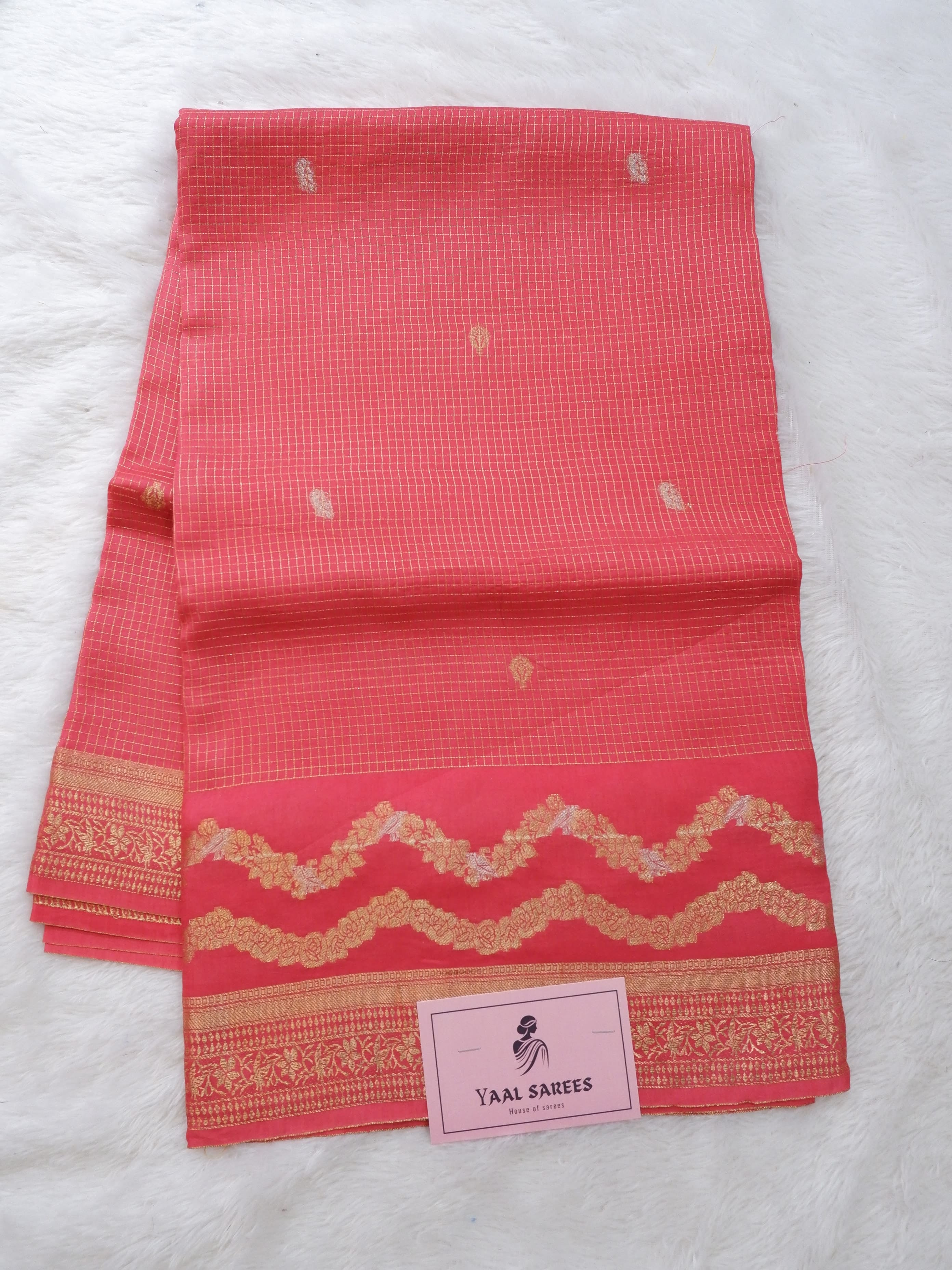 Red saree with gold patterns 