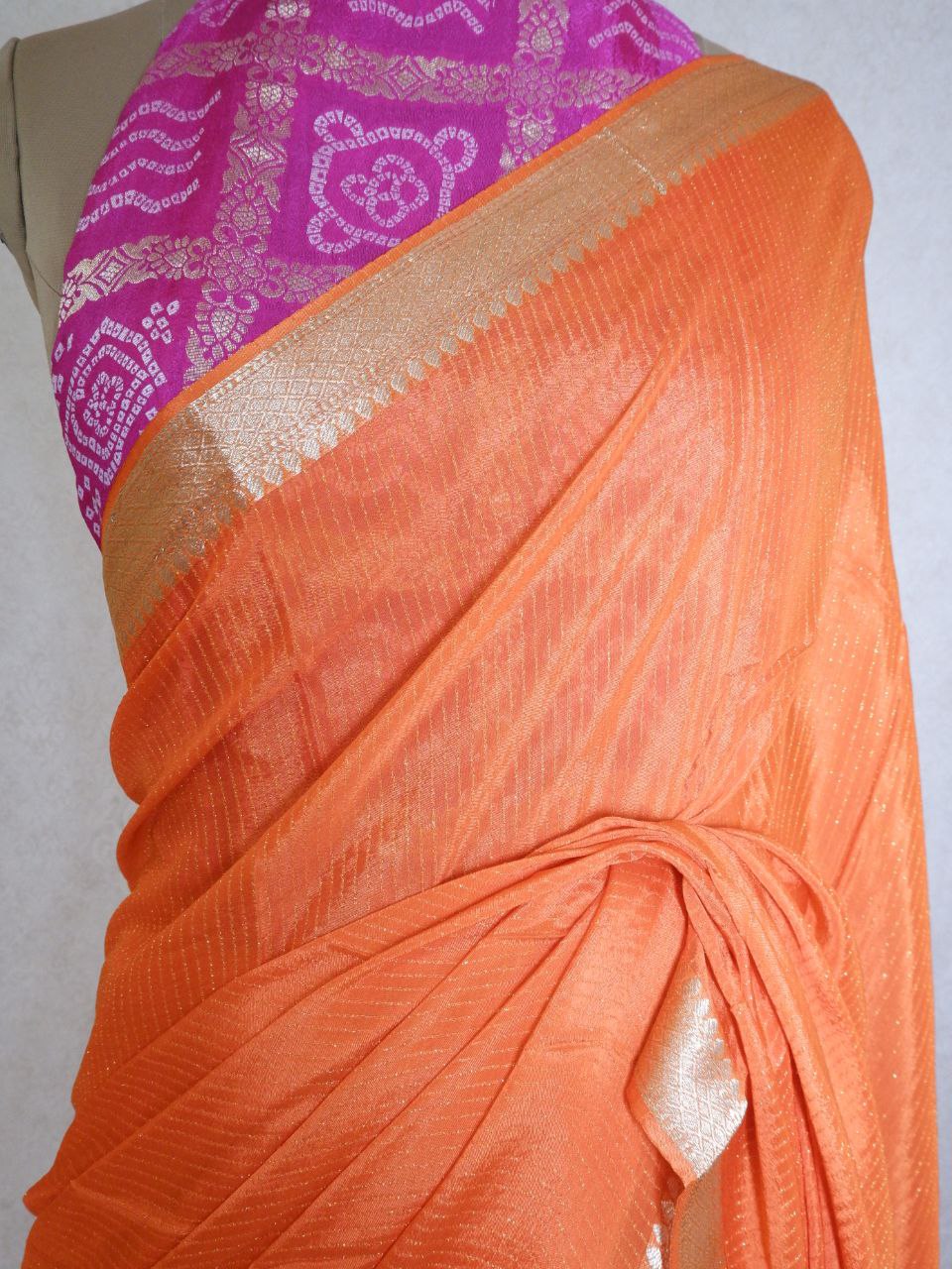 Chinnon lines orange  color  saree with pink blouse