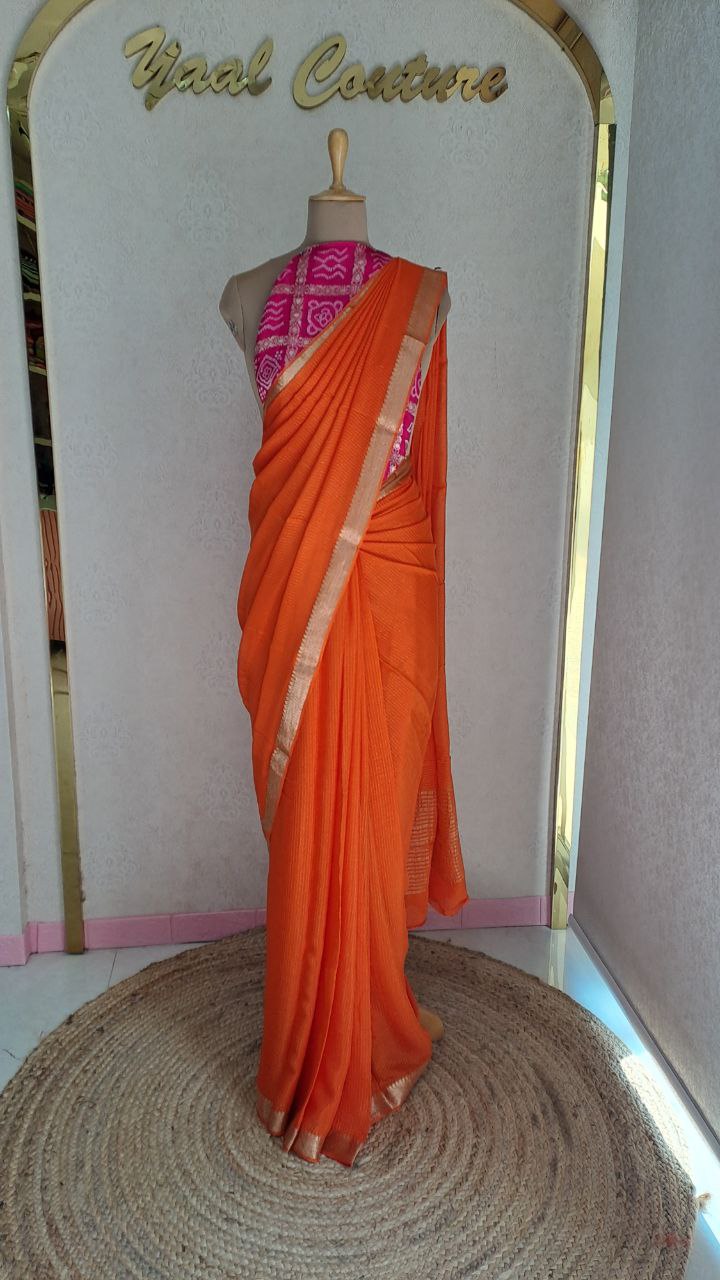 Chinnon lines orange  color  saree with pink blouse