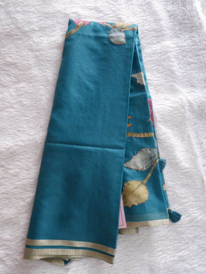 Teal fabric with floral patterns 