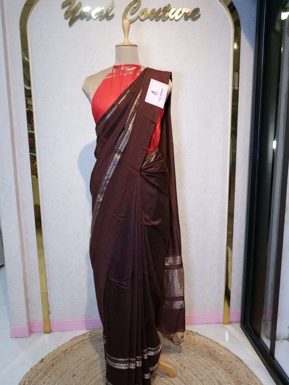 Brown saree with a red blouse